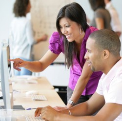 Woman and man at computer